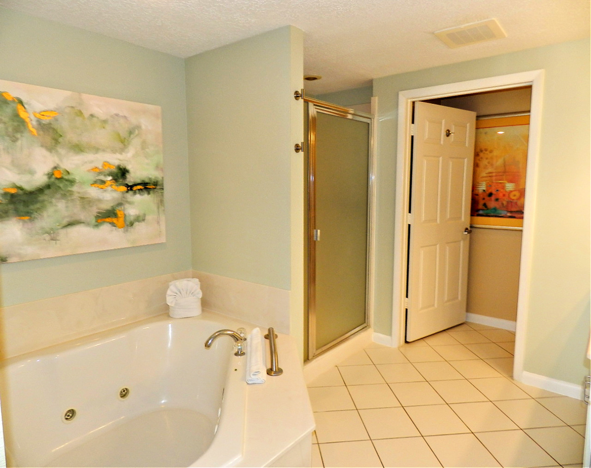 Large guest bedroom with ocean view window